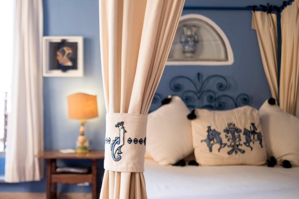 Postel nebo postele na pokoji v ubytování Su Gologone Experience Hotel