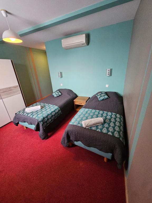 Postel nebo postele na pokoji v ubytování Les chambres du grès