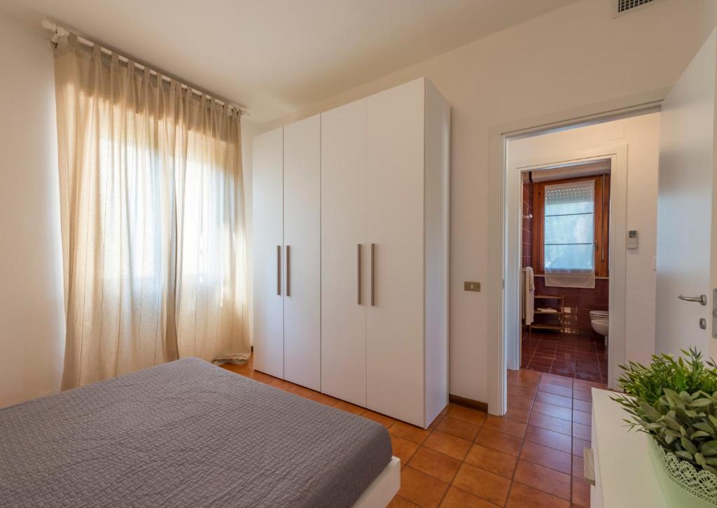 Posteľ alebo postele v izbe v ubytovaní Caletta Apartments