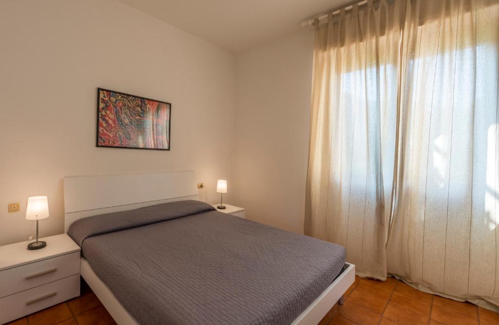 Posteľ alebo postele v izbe v ubytovaní Caletta Apartments