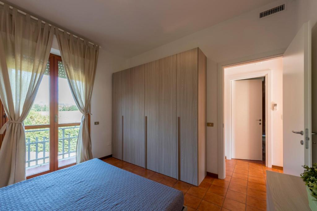 Posteľ alebo postele v izbe v ubytovaní Caletta Apartments
