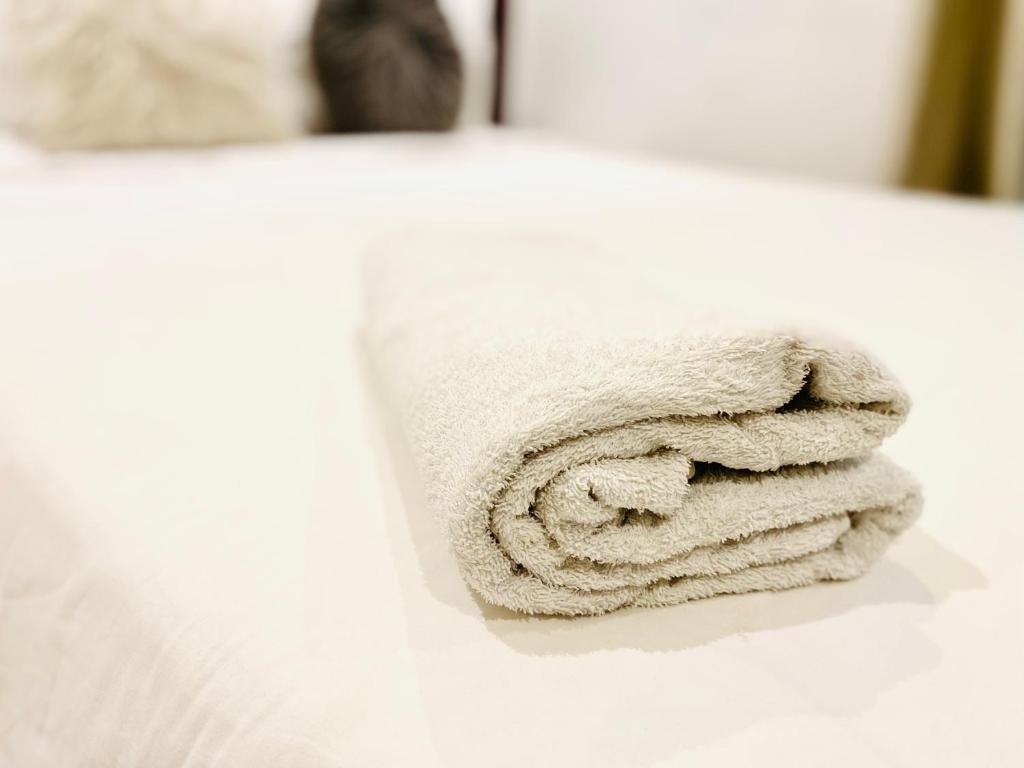 a pile of towels sitting on top of a counter at KS Unique Studio Apartment in Accra
