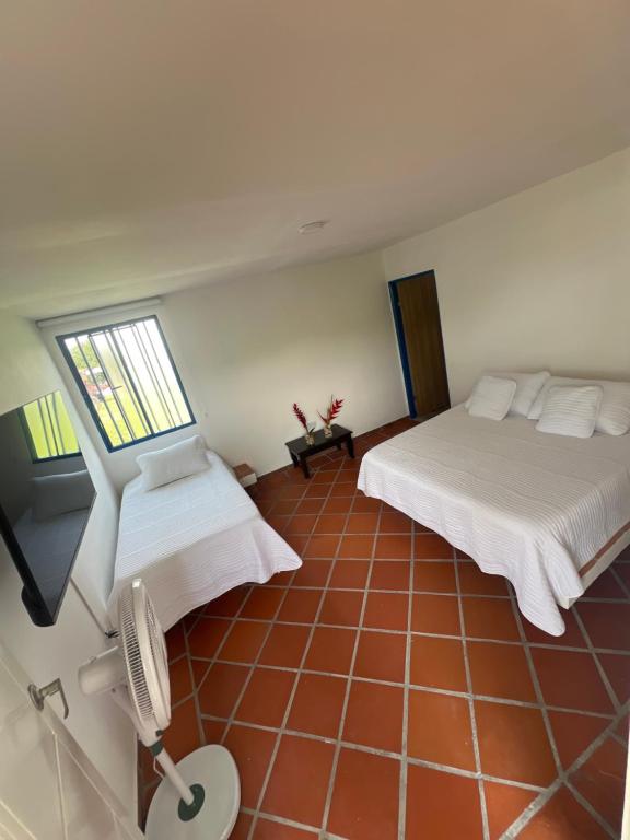 Postel nebo postele na pokoji v ubytování Hotel Casa Cuenca