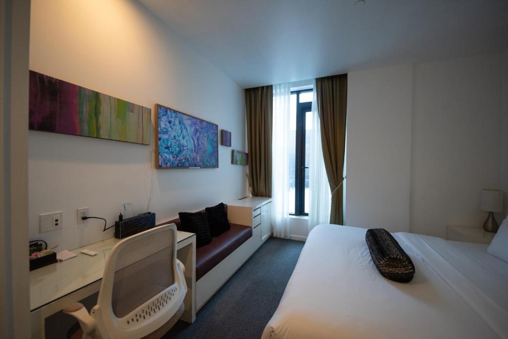 Postel nebo postele na pokoji v ubytování The One Boutique Hotel