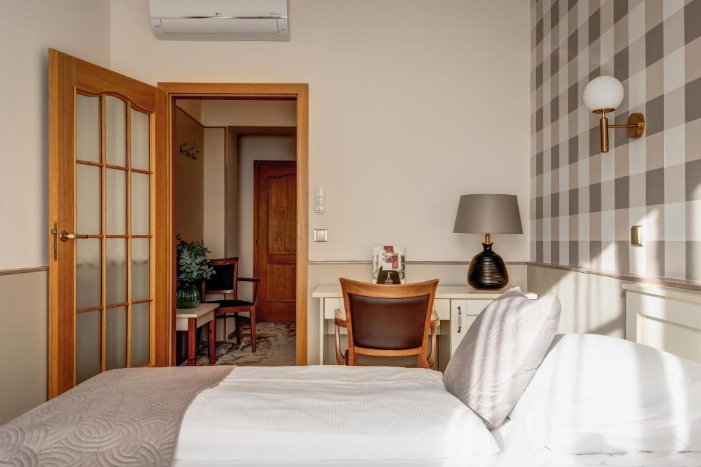 Postel nebo postele na pokoji v ubytování Hotel Golfi