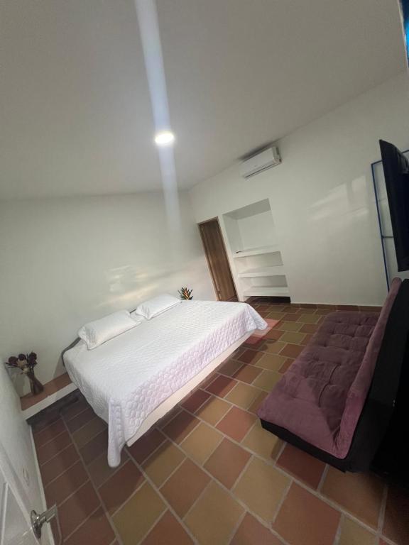 Postel nebo postele na pokoji v ubytování Hotel Casa Cuenca
