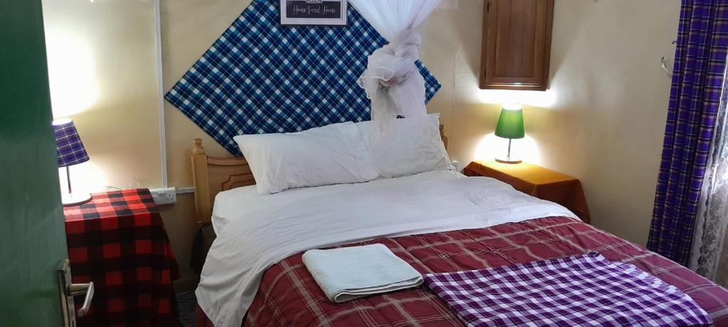 Postel nebo postele na pokoji v ubytování Mara Sidain safaris