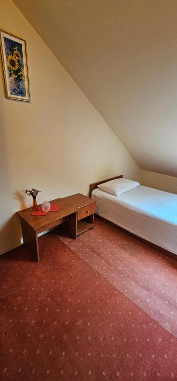 Postel nebo postele na pokoji v ubytování Hotel Olimp - 2 stele