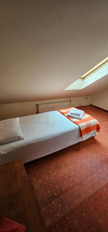 Postel nebo postele na pokoji v ubytování Hotel Olimp - 2 stele