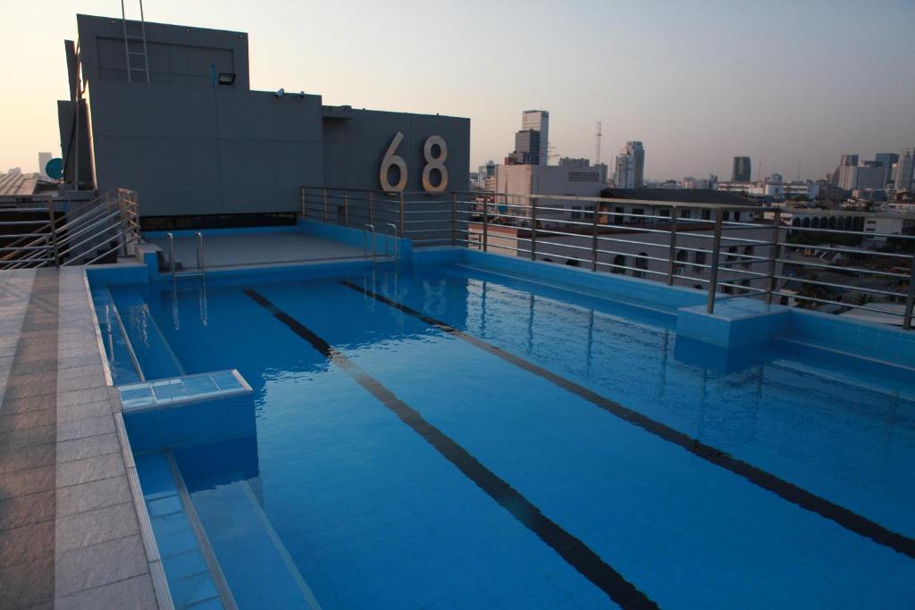 a swimming pool on the roof of a building at Bangkok 68 in Bangkok