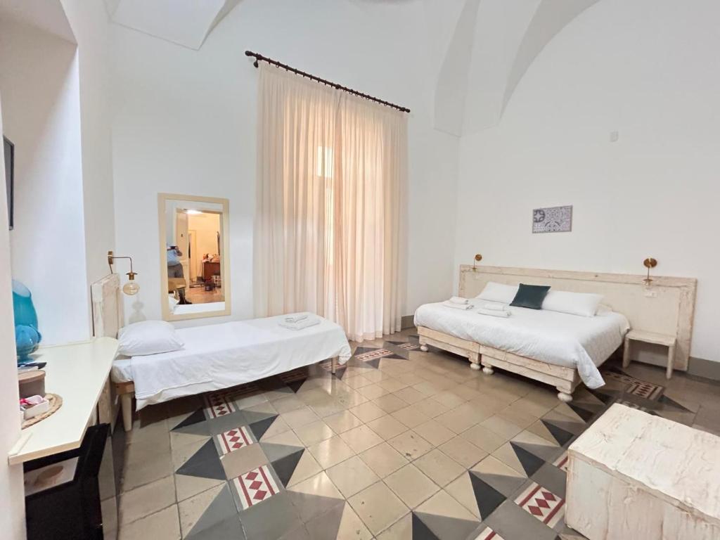 Postel nebo postele na pokoji v ubytování Damasa Rooms