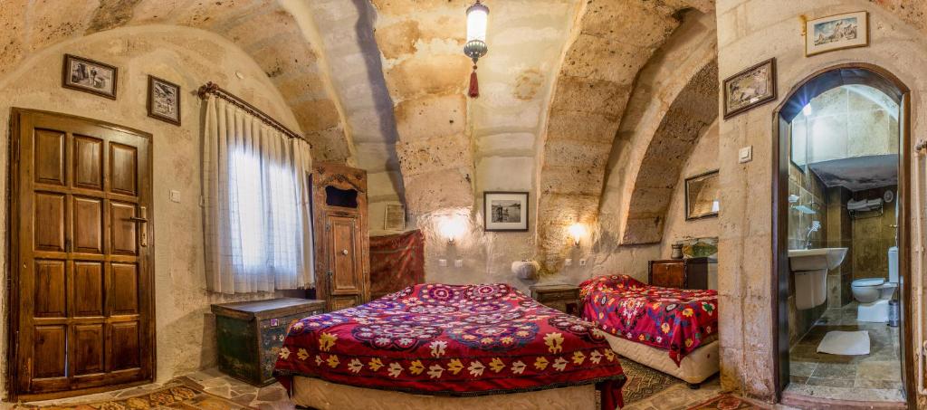 Postel nebo postele na pokoji v ubytování Kirkit Hotel