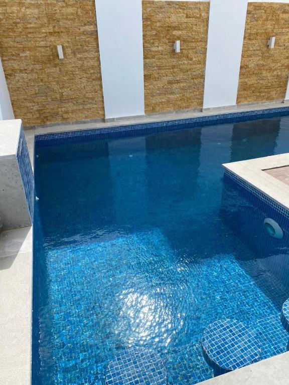 Bazén v ubytování Le Coin Paradisiaque nebo v jeho okolí