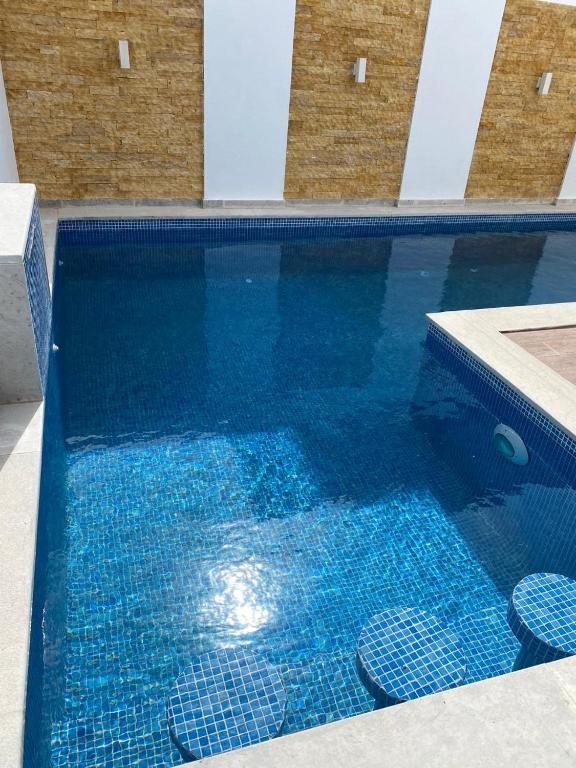 Bazén v ubytování Le Coin Paradisiaque nebo v jeho okolí