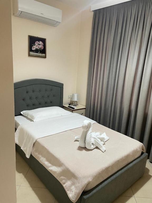 Postel nebo postele na pokoji v ubytování R HOTEL