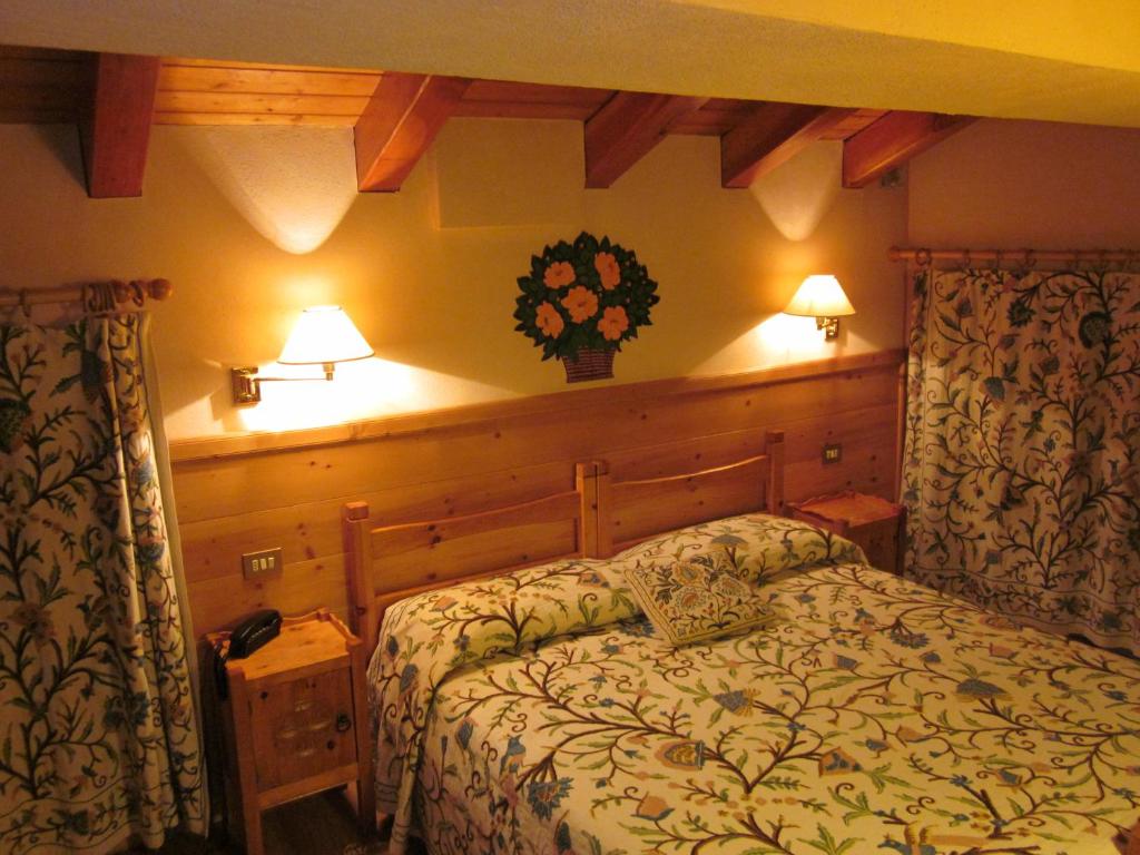 Postel nebo postele na pokoji v ubytování Hotel Mignon