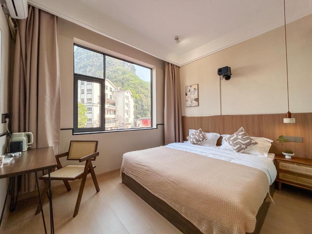 Ένα ή περισσότερα κρεβάτια σε δωμάτιο στο Taoshe Mountain Guesthouse