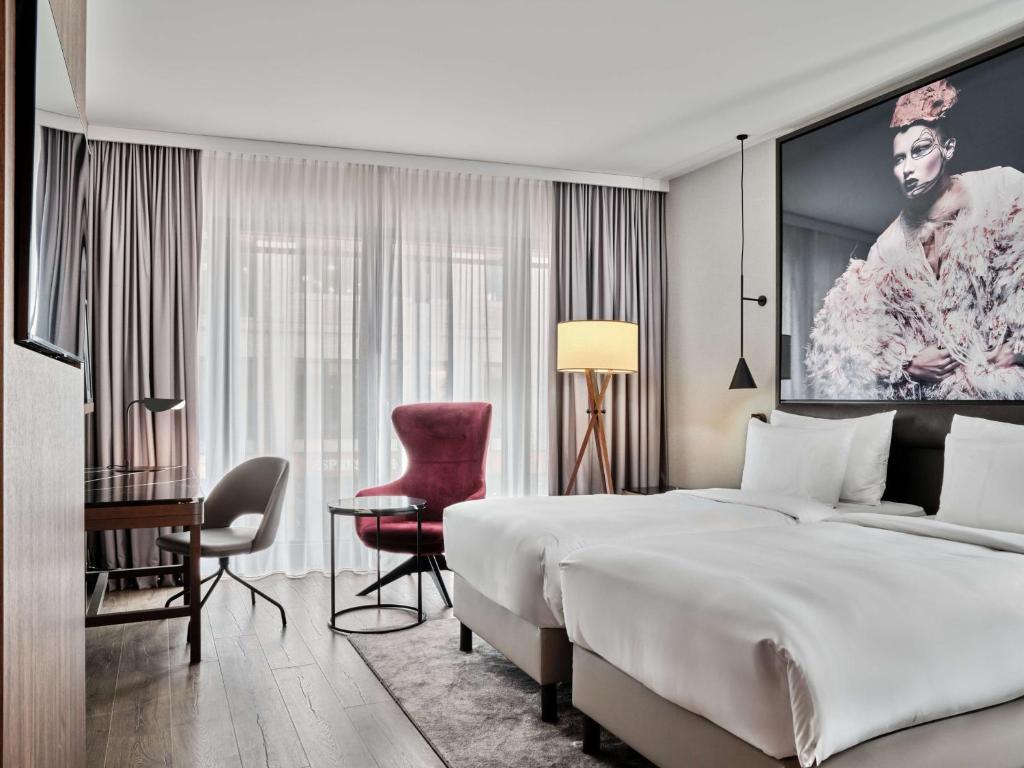 Postel nebo postele na pokoji v ubytování Radisson Collection Hotel, Berlin