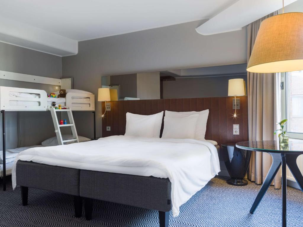 Postel nebo postele na pokoji v ubytování Radisson Blu Arlandia Hotel, Stockholm-Arlanda