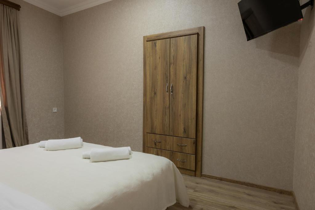 Postel nebo postele na pokoji v ubytování Bliss House