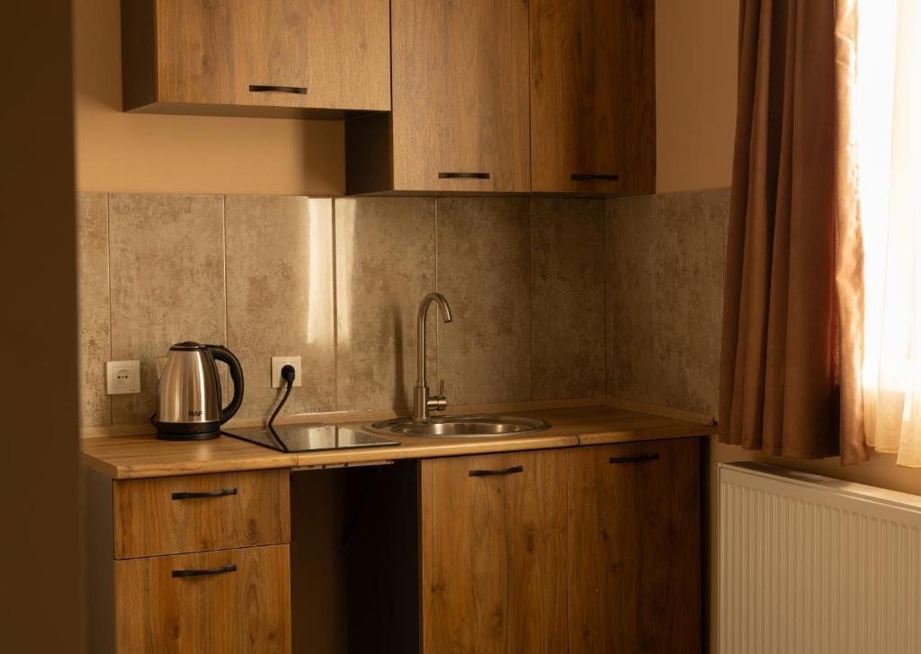 Kuchyň nebo kuchyňský kout v ubytování Bliss House