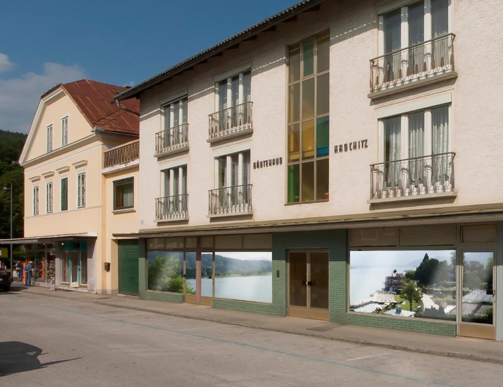 a building with windows on the side of a street at Apartements Kaschitz in Pörtschach am Wörthersee