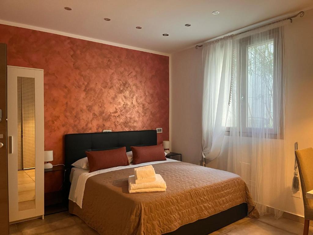 Postel nebo postele na pokoji v ubytování Harmony Lake Sirmione
