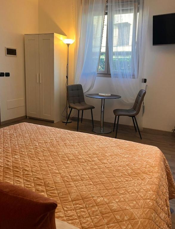 Postel nebo postele na pokoji v ubytování Harmony Lake Sirmione