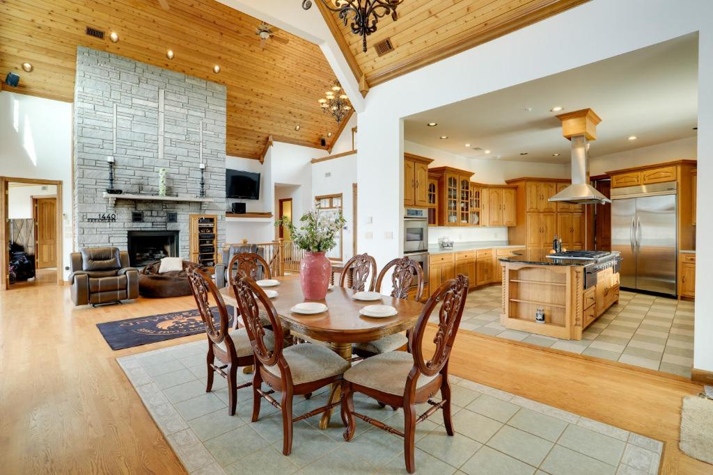 a kitchen and living room with a table and chairs at 366 Shared Acres, Lake Access: Ozark Getaway! in Fairfield Bay