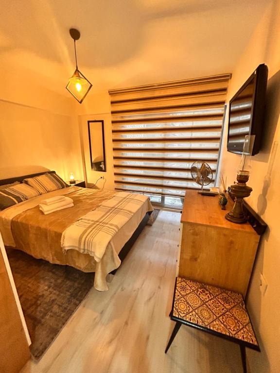 Postel nebo postele na pokoji v ubytování Izmir Home & Garden