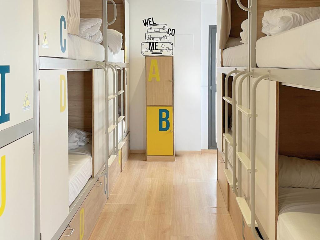 Posteľ alebo postele v izbe v ubytovaní U-Sense For You Hostel Sevilla