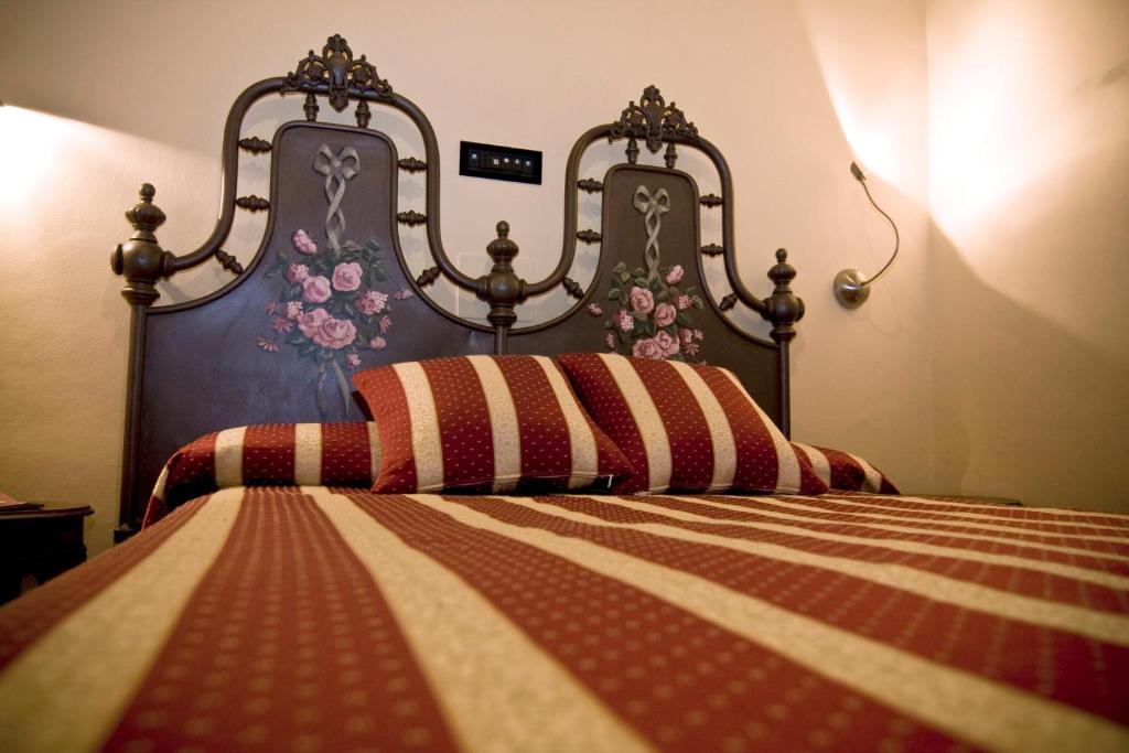 Postel nebo postele na pokoji v ubytování Hotel Regina