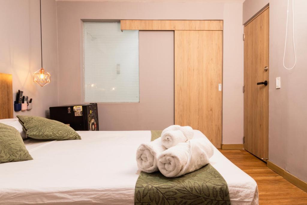 Postel nebo postele na pokoji v ubytování Hotel Casa 73 Deluxe