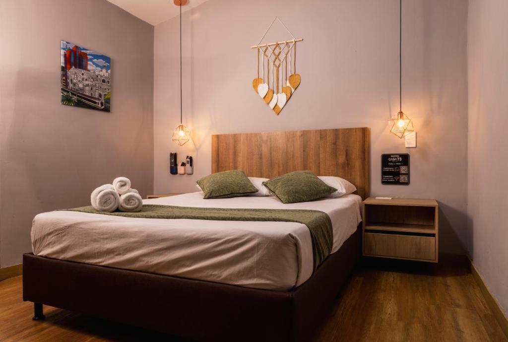 Postel nebo postele na pokoji v ubytování Hotel Casa 73 Deluxe