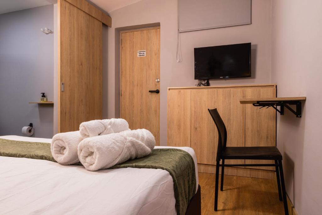 Postel nebo postele na pokoji v ubytování Hotel Casa 73 Deluxe