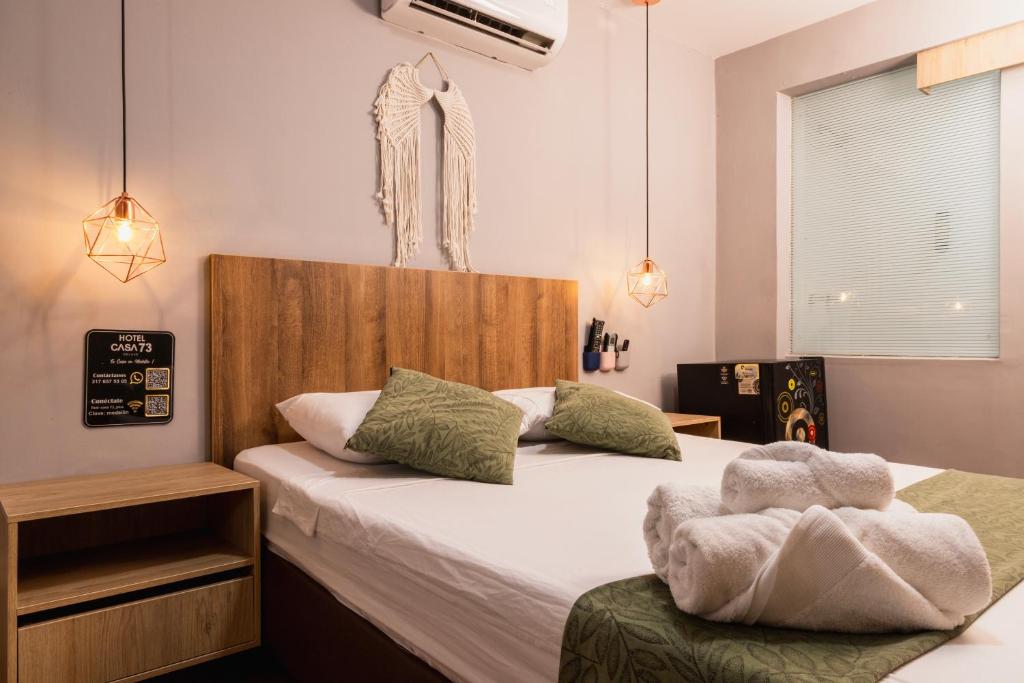 Postel nebo postele na pokoji v ubytování Hotel Casa 73 Deluxe