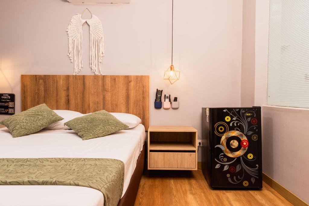 Postel nebo postele na pokoji v ubytování Hotel Casa 73 Deluxe