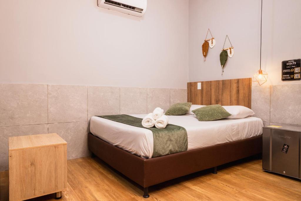 Postel nebo postele na pokoji v ubytování Hotel Casa 73 Deluxe