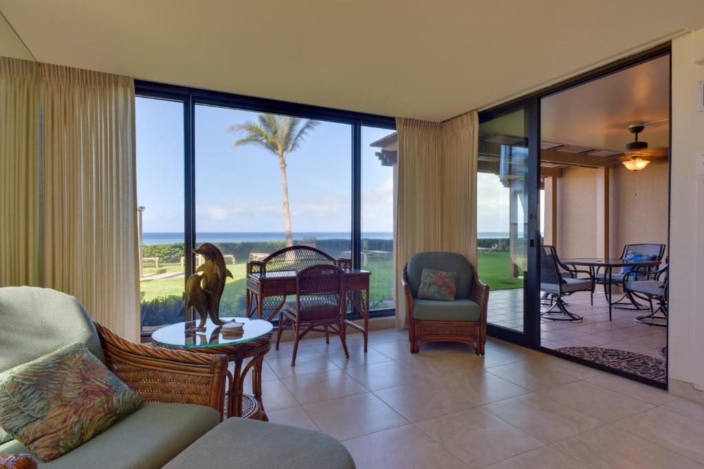 a living room with a view of the ocean at Lahaina Condo with Patio, Ocean Views and Pool Access! in Kahana