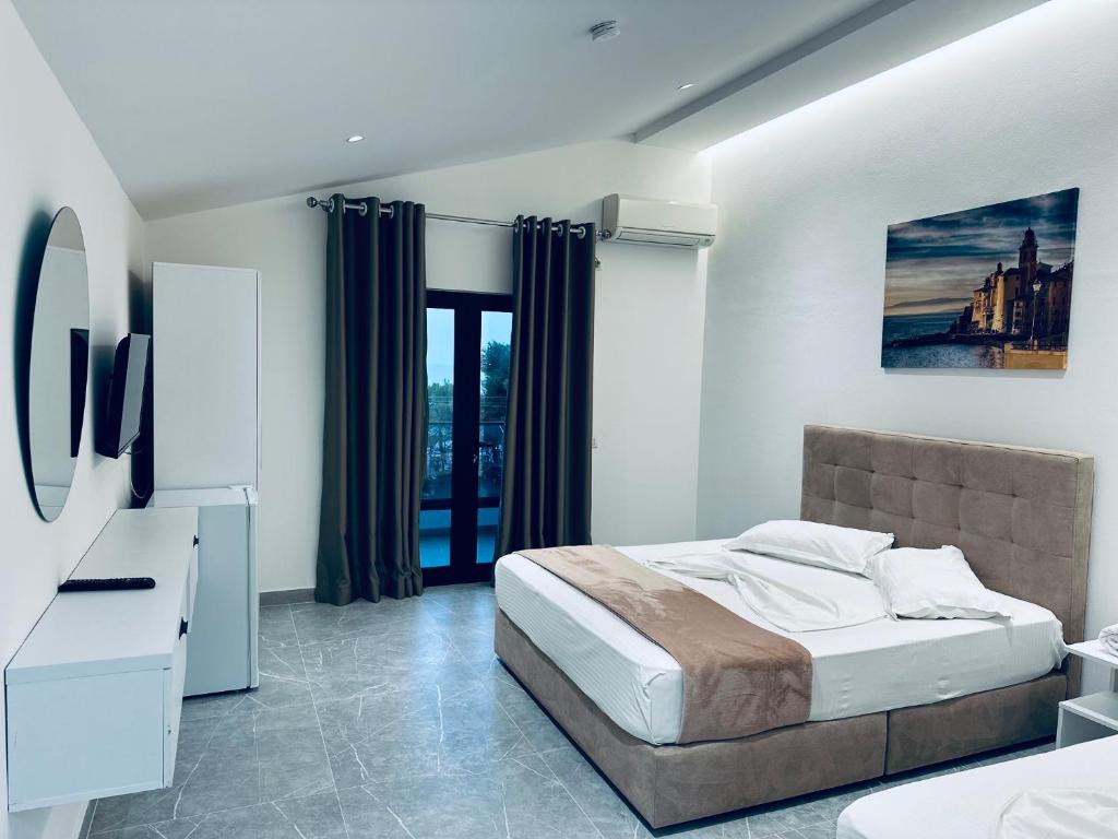 Postel nebo postele na pokoji v ubytování Molla Hotel Restorant