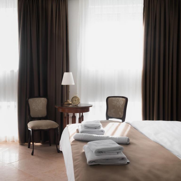 Postel nebo postele na pokoji v ubytování Hotel Jardin