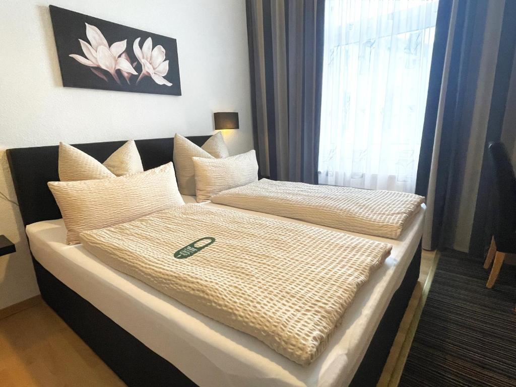 Postel nebo postele na pokoji v ubytování Hotel Antoni