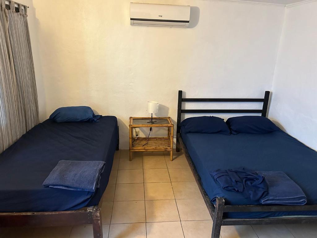 Postel nebo postele na pokoji v ubytování Pura Vida Hostel