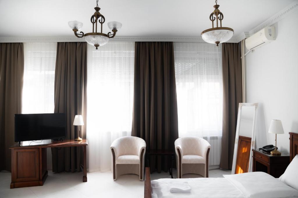Postel nebo postele na pokoji v ubytování Hotel Jardin
