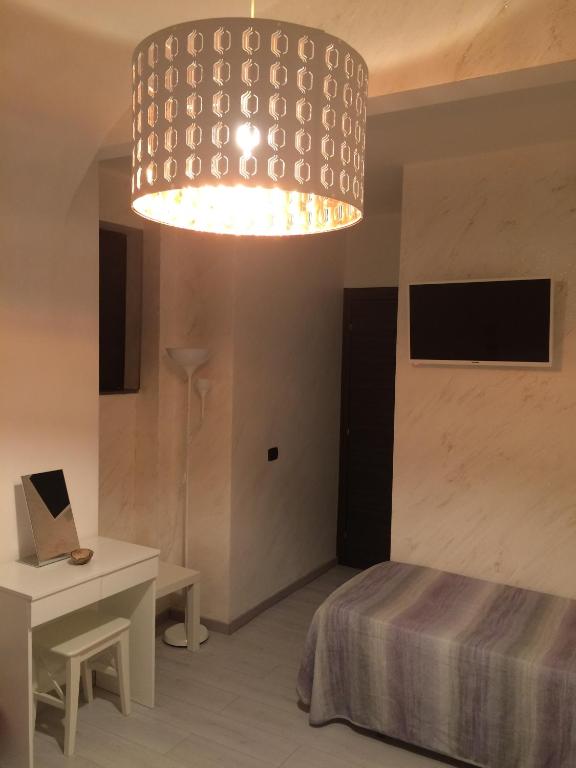 Posteľ alebo postele v izbe v ubytovaní B&B Massimo Centro