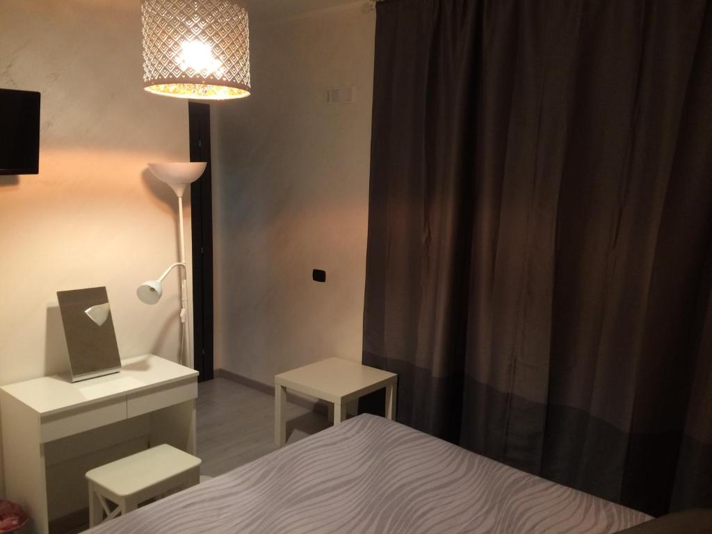 Posteľ alebo postele v izbe v ubytovaní B&B Massimo Centro