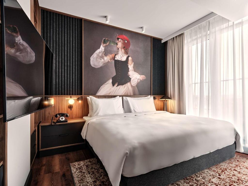 Radisson RED Hotel & Radisson RED Apartments, Krakówにあるベッド