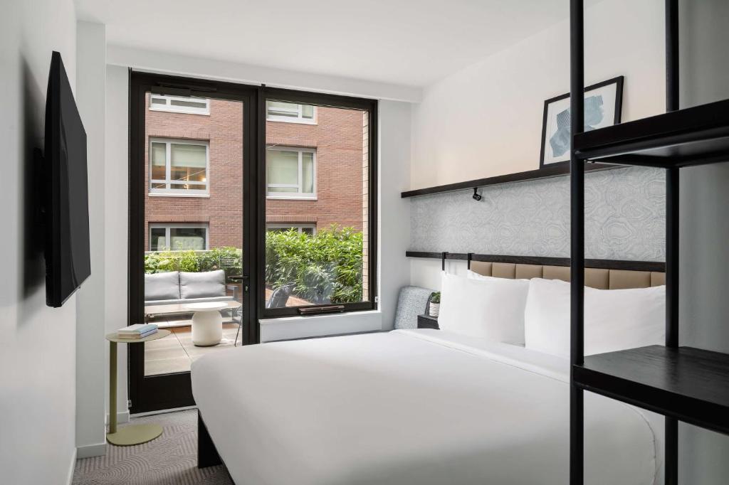 Postel nebo postele na pokoji v ubytování Arlo Midtown