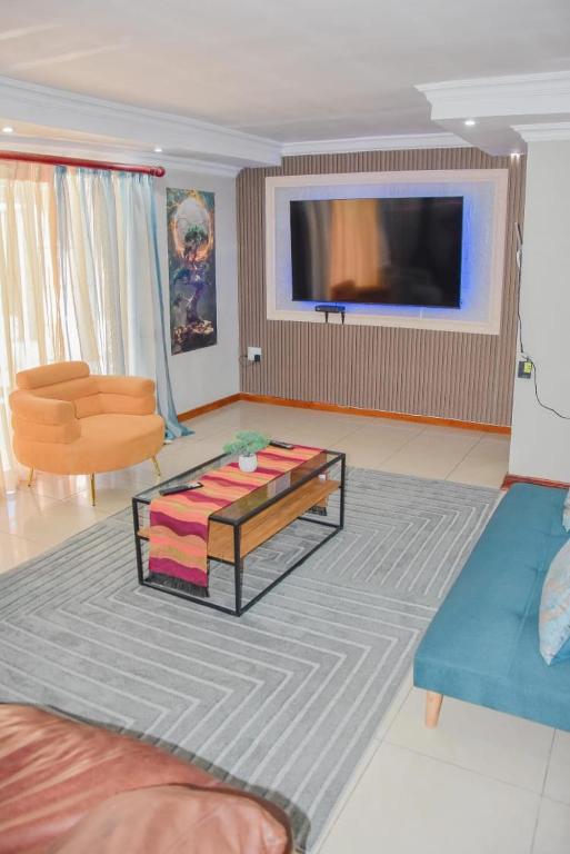 a living room with a couch and a coffee table at Modern and Executive 2 Bedroom Townhouse in Bloemfontein