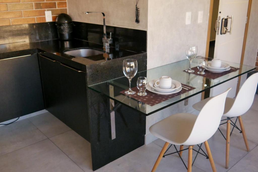 A cozinha ou cozinha compacta de Reserva Madero Loft Natal Hotel